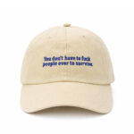 Cream Egotrips Dad Cap "You Don't Have To Fuck People Over To Survive" with front embroidered.