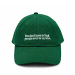 Green Egotrips Dad Cap "You Don't Have To Fuck People Over To Survive" with front embroidered.